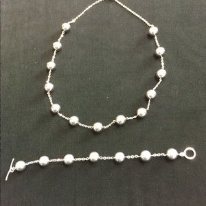 Stainless steel necklace and bracelet set.